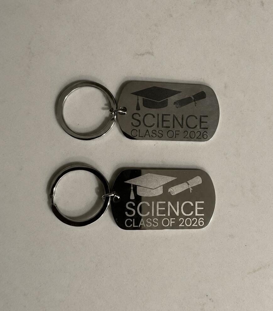 Two stainless steel keychain tags engraved with a graduation cap, diploma and the words Science Class of 2026